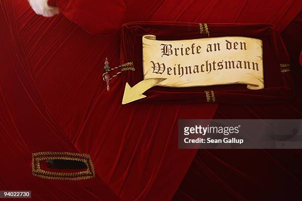 "Letters for Santa Claus" reads a sign with an arrow pointing to an opening for mail on a decoration at the Schloss Steglitz shopping mall on...