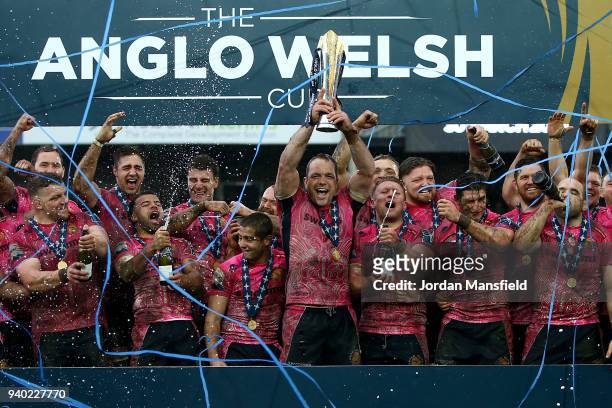 Kai Horstmann of Exeter Chiefs lifts the Anglo-Welsh trophy and celebrates with team mates after winning the Final between Bath Rugby and Exeter...