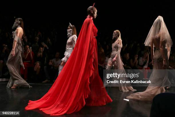 Models walk the runway at the Zeynep Tosun show during Mercedes Benz Fashion Week Istanbul at Zorlu Performance Hall on March 30, 2018 in Istanbul,...
