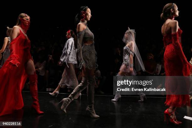 Models walk the runway at the Zeynep Tosun show during Mercedes Benz Fashion Week Istanbul at Zorlu Performance Hall on March 30, 2018 in Istanbul,...