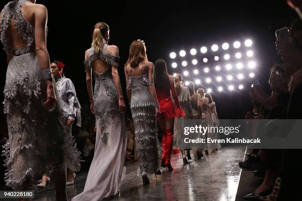 Models walk the runway at the Zeynep Tosun show during Mercedes Benz Fashion Week Istanbul at Zorlu Performance Hall on March 30, 2018 in Istanbul,...