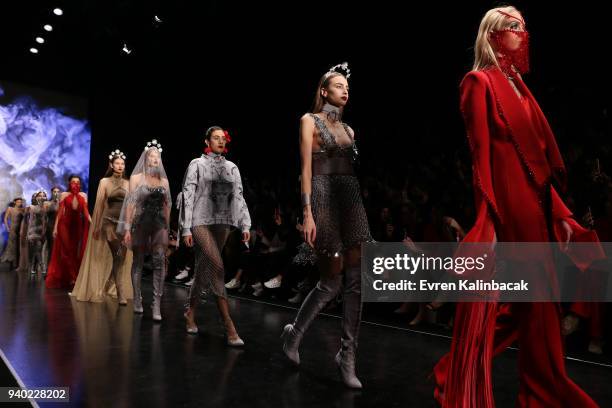 Models walk the runway at the Zeynep Tosun show during Mercedes Benz Fashion Week Istanbul at Zorlu Performance Hall on March 30, 2018 in Istanbul,...