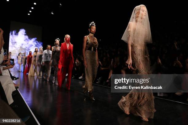 Models walk the runway at the Zeynep Tosun show during Mercedes Benz Fashion Week Istanbul at Zorlu Performance Hall on March 30, 2018 in Istanbul,...