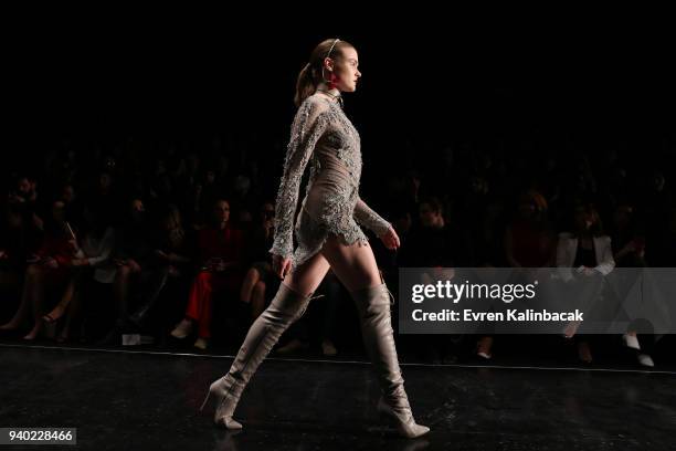 Model walks the runway at the Zeynep Tosun show during Mercedes Benz Fashion Week Istanbul at Zorlu Performance Hall on March 30, 2018 in Istanbul,...