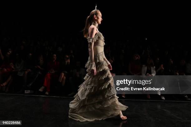 Model walks the runway at the Zeynep Tosun show during Mercedes Benz Fashion Week Istanbul at Zorlu Performance Hall on March 30, 2018 in Istanbul,...