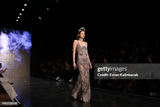 Model walks the runway at the Zeynep Tosun show during Mercedes Benz Fashion Week Istanbul at Zorlu Performance Hall on March 30, 2018 in Istanbul,...