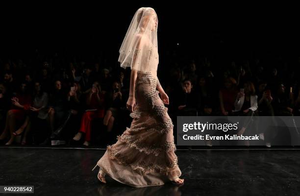 Model walks the runway at the Zeynep Tosun show during Mercedes Benz Fashion Week Istanbul at Zorlu Performance Hall on March 30, 2018 in Istanbul,...