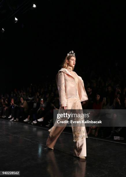 Model walks the runway at the Zeynep Tosun show during Mercedes Benz Fashion Week Istanbul at Zorlu Performance Hall on March 30, 2018 in Istanbul,...