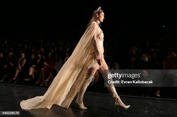 Model walks the runway at the Zeynep Tosun show during Mercedes Benz Fashion Week Istanbul at Zorlu Performance Hall on March 30, 2018 in Istanbul,...