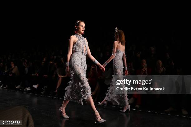 Models walk the runway at the Zeynep Tosun show during Mercedes Benz Fashion Week Istanbul at Zorlu Performance Hall on March 30, 2018 in Istanbul,...