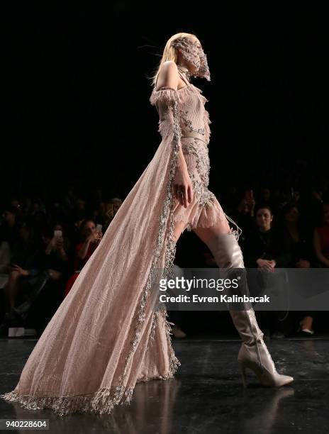 Model walks the runway at the Zeynep Tosun show during Mercedes Benz Fashion Week Istanbul at Zorlu Performance Hall on March 30, 2018 in Istanbul,...
