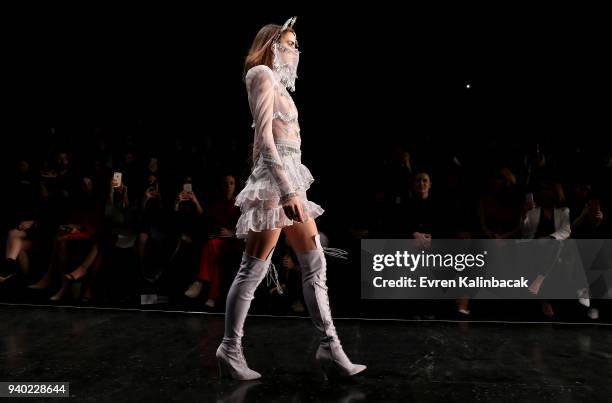 Model walks the runway at the Zeynep Tosun show during Mercedes Benz Fashion Week Istanbul at Zorlu Performance Hall on March 30, 2018 in Istanbul,...