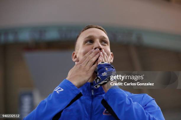 Caeleb Dressel of Florida, blows kisses to the crowd standing atop the first place podium during the Division I Men's Swimming & Diving Championship...