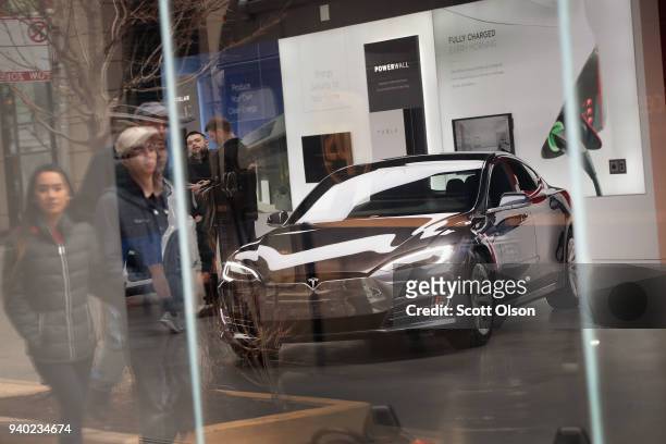 Model S sits on the showroom floor at a Tesla dealership on March 30, 2018 in Chicago, Illinois. Tesla has announced it is recalling 123,000 of its...