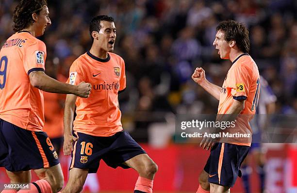 Lionel Messi of Barcelona celebrates scoring with his teammates Zlatan Ibrahimovic and Sergio Busquets during the La Liga match between Deportivo La...