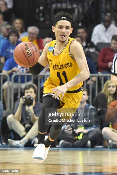 Maura of the UMBC Retrievers dribbles up court during the second round of the 2018 NCAA Men's Basketball Tournament against the Kansas State Wildcats...