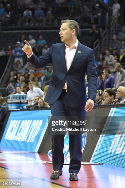 Head coach Ryan Odom of the UMBC Retrievers looks on during the second round of the 2018 NCAA Men's Basketball Tournament against the Kansas State...