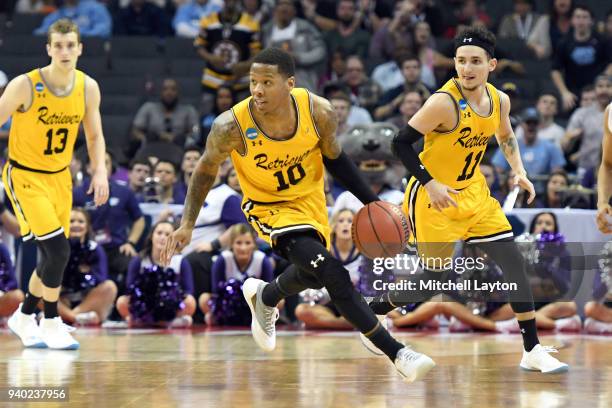 Jairus Lyles of the UMBC Retrievers dribbles up court during the second round of the 2018 NCAA Men's Basketball Tournament against the Kansas State...