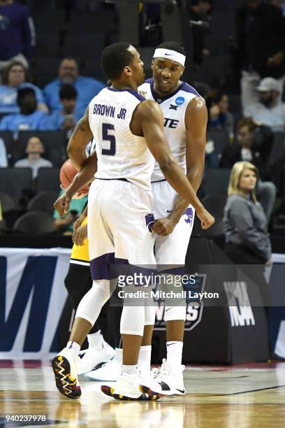 Barry Brown Jr. #5 and Xavier Sneed of the Kansas State Wildcats celebrrate a win during the second round of the 2018 NCAA Men's Basketball...