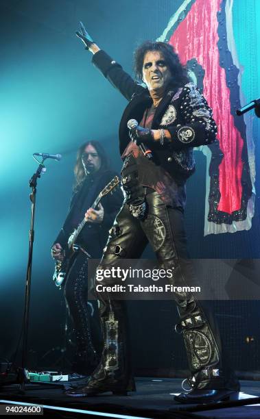 Damon Johnson and Alice Cooper perform on stage at the Brighton Centre on December 5, 2009 in Brighton, England.