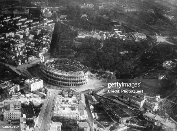 Aerial view of the Colosseum and the Arch of Constantine , Rome, Italy, 1920.