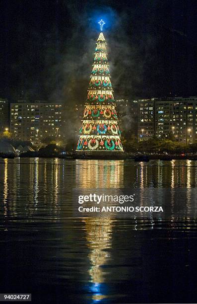 The biggest floating Christmas tree in the world is reflected in the Rodrigo de Freitas Lagoon in Rio de Janeiro, Brazil, on December 5, 2009. AFP...