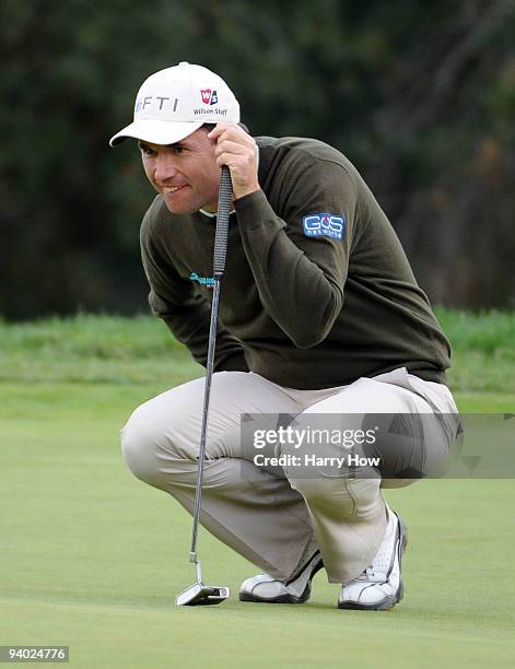 Padraig Harrington of Ireland lines up a putt on the 18th green during the third round of the Chevron World Challenge at Sherwood Country Club on...