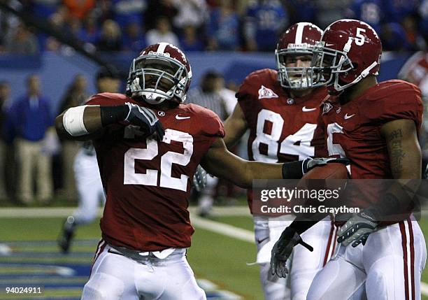 Mark Ingram, Colin Peek and Roy Upchurch of the Alabama Crimson Tide celebrate after Ingram scored a 3-yard rushing touchdown in the second quarter...