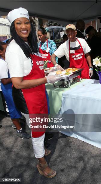 Actress Garcelle Beauvais, Helen Lasichanh and musician Pharrell Williams attend the Los Angeles Mission Easter charity event at the Los Angeles...