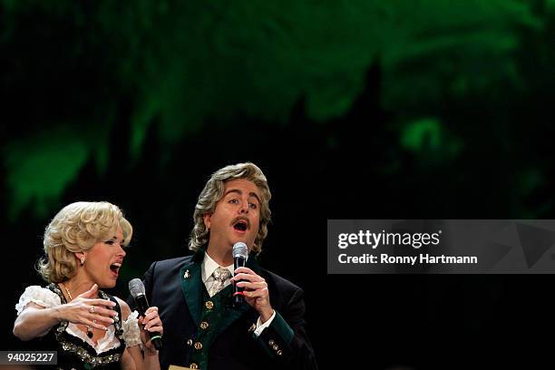 Comedians Anke Engelke and Bastian Pastewka perform as Wolfgang and Anneliese during the Wetten dass...? show at the AWD Dome on December 5, 2009 in...