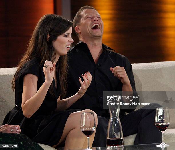 Actors Nora Tschirner and Til Schweiger laugh during the Wetten dass...? show at the AWD Dome on December 5, 2009 in Bremen, Germany.
