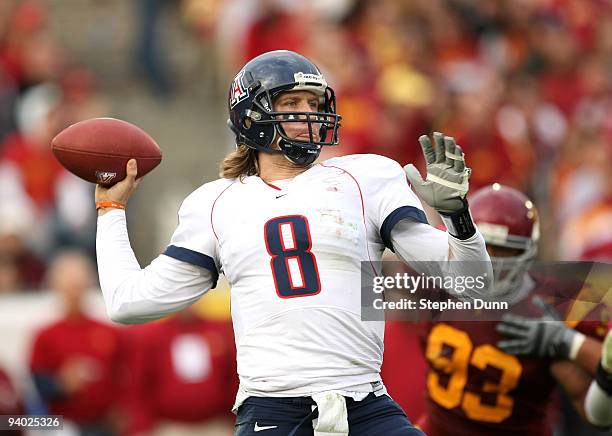 Quarterback Nick Foles of the Arizona Wildcats throws a pass against the USC Trojans on December 5, 2009 at the Los Angeles Coliseum in Los Angeles,...