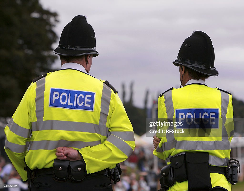 Police men at summer fair showground