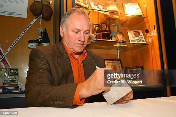 Hall of Famer Gilbert Perreault, formerly of the Buffalo Sabres, autographs commemorative limestone bricks taken from the recently demolished...