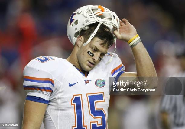 Quarterback Tim Tebow of the Florida Gators reacts after he threw an interception in the redzone in the fourth quarter against the Alabama Crimson...