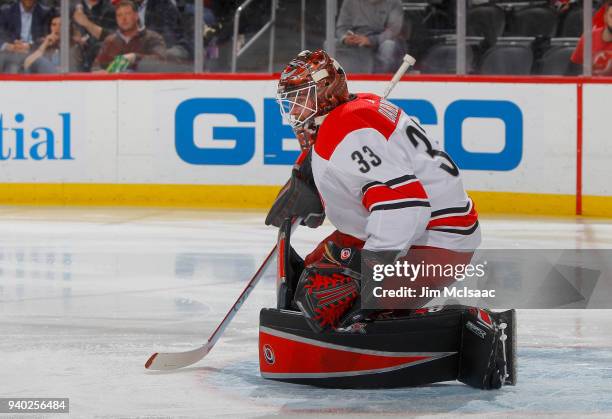 Scott Darling of the Carolina Hurricanes in action against the New Jersey Devils on March 27, 2018 at Prudential Center in Newark, New Jersey. The...