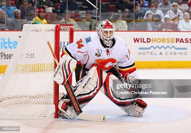 Goaltender Miikka Kiprusoff of the Calgary Flames during the NHL game against the Phoenix Coyotes at Jobing.com Arena on December 3, 2009 in...