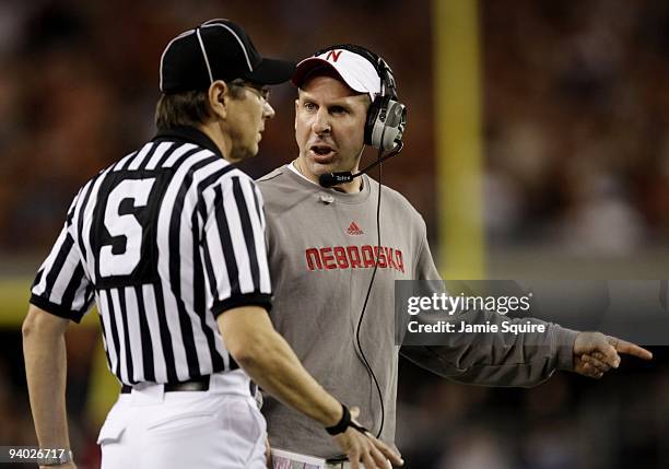 Head coach Bo Pelini of the Nebraska Cornhuskers speaks to the referee during the first quarter of the game the Texas Longhorns at Cowboys Stadium on...
