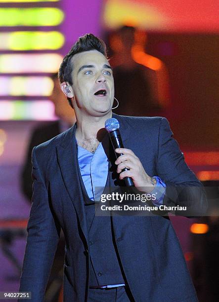 Robbie Williams performs at the 2010 Miss France Beauty pageant at the Palais Nikaia on December 5, 2009 in Nice, France.