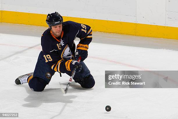 Tim Connolly of the Buffalo Sabres makes a pass from his knees against the New York Rangers at HSBC Arena on December 5, 2009 in Buffalo, New York.