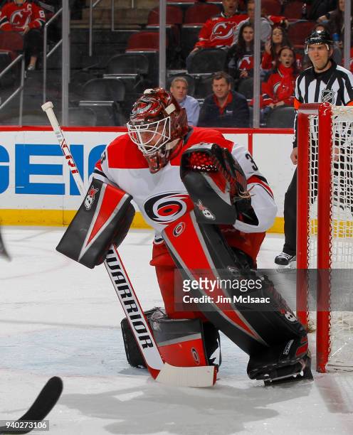 Scott Darling of the Carolina Hurricanes in action against the New Jersey Devils on March 27, 2018 at Prudential Center in Newark, New Jersey. The...