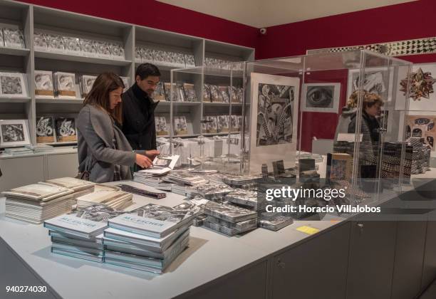 Visitors at Museu de Arte Popular shop with merchandise related to Dutch artist Maurits Cornelis Escher exhibition on March 30, 2018 in Lisbon,...