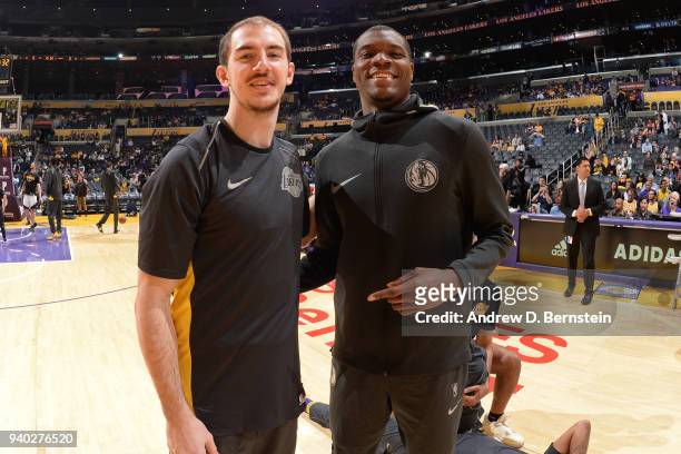 Alex Caruso of the Los Angeles Lakers and Dorian Finney-Smith of the Dallas Mavericks look on prior to the game between the two teams on March 28,...