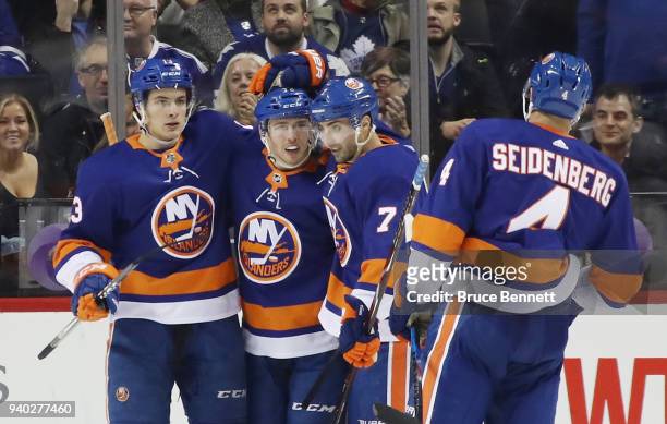 Mathew Barzal, Anthony Beauvillier, Jordan Eberle and Dennis Seidenberg of the New York Islanders celebrate a first-period goal by Beauvillier at the...
