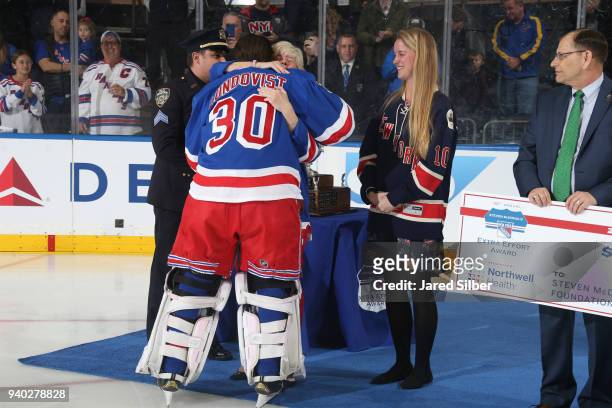 Henrik Lundqvist of the New York Rangers greets Patti Ann McDonald, wife of Steven McDonald, after being named the winner of the 2017-2018 Steven...