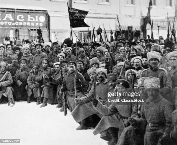 1900s 1917 SIBERIAN RIFLES AND COSSACKS TROOPS WITH SIGNS DOWN WITH MONARCHY ON WAY TO DUMA IN PETROGRAD ST. PETERSBURG RUSSIA