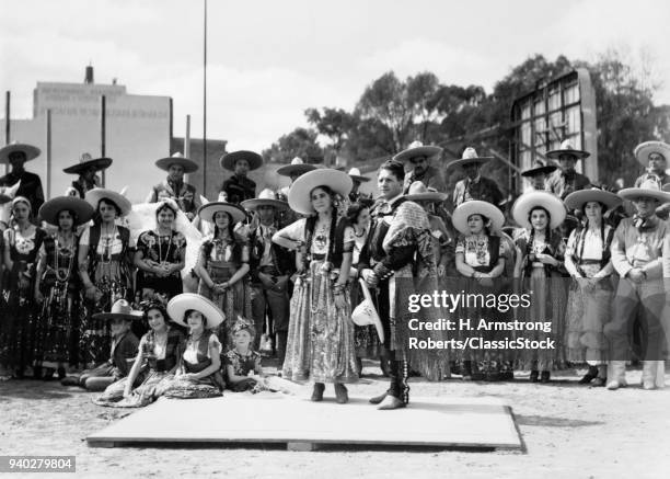 1930s GROUP OF PEOPLE WEARING TRADITIONAL CHARRO COWBOY AND CHINA POBLANA COSTUMES MEXICO