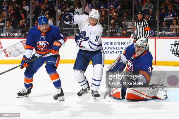 Zach Hyman of the Toronto Maple Leafs attempts to screen Christopher Gibson of the New York Islanders at Barclays Center on March 30, 2018 in New...