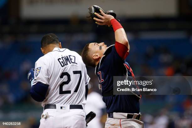 Catcher Christian Vazquez of the Boston Red Sox hauls in the pop pout by Carlos Gomez of the Tampa Bay Rays during the fourth inning of a game on...