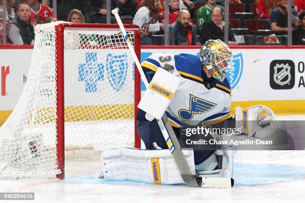 Goalie Jake Allen of the St. Louis Blues catches the puck in the second period against the Chicago Blackhawks at the United Center on March 18, 2018...